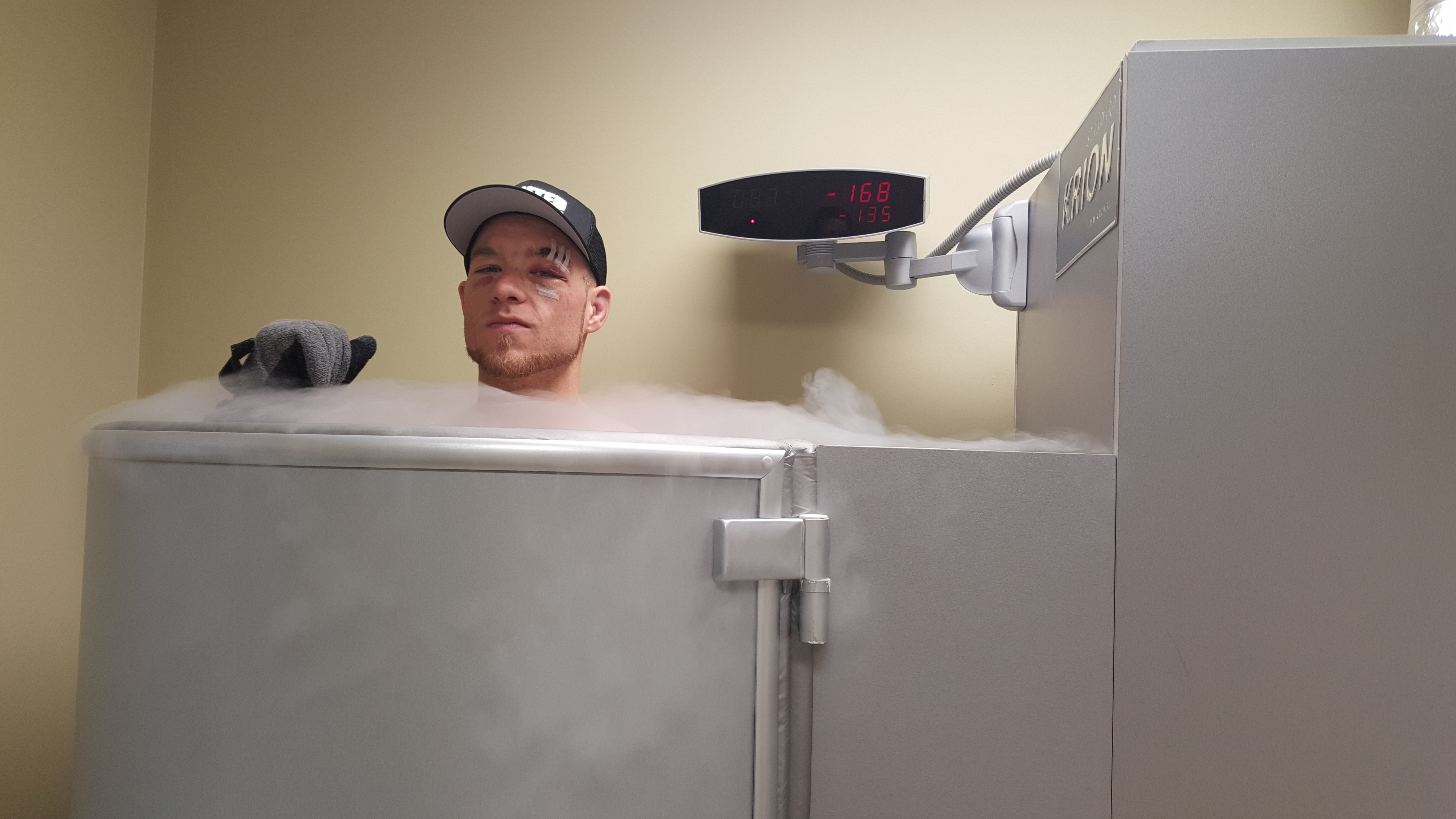 Professional athlete experiencing whole body cryotherapy session